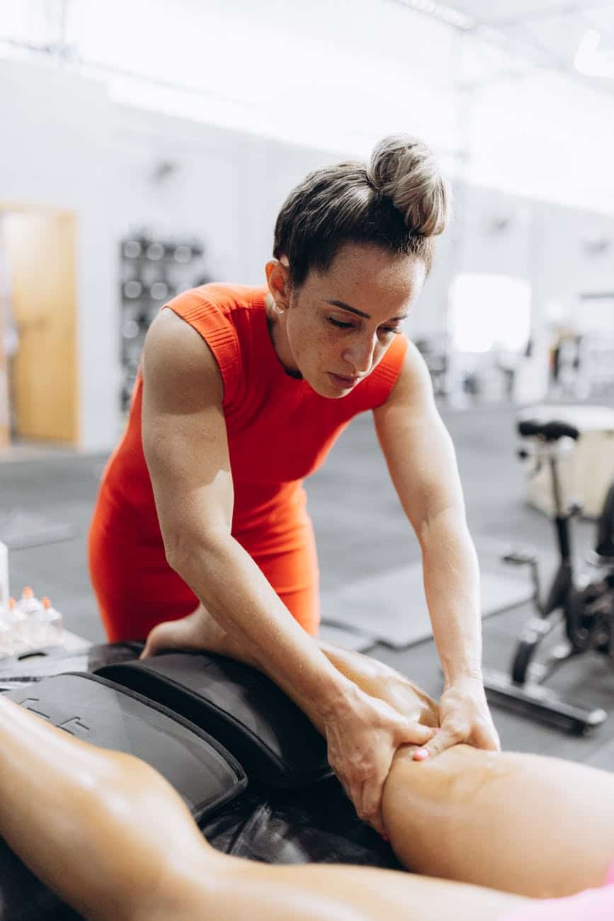 a woman getting a massage in a gym