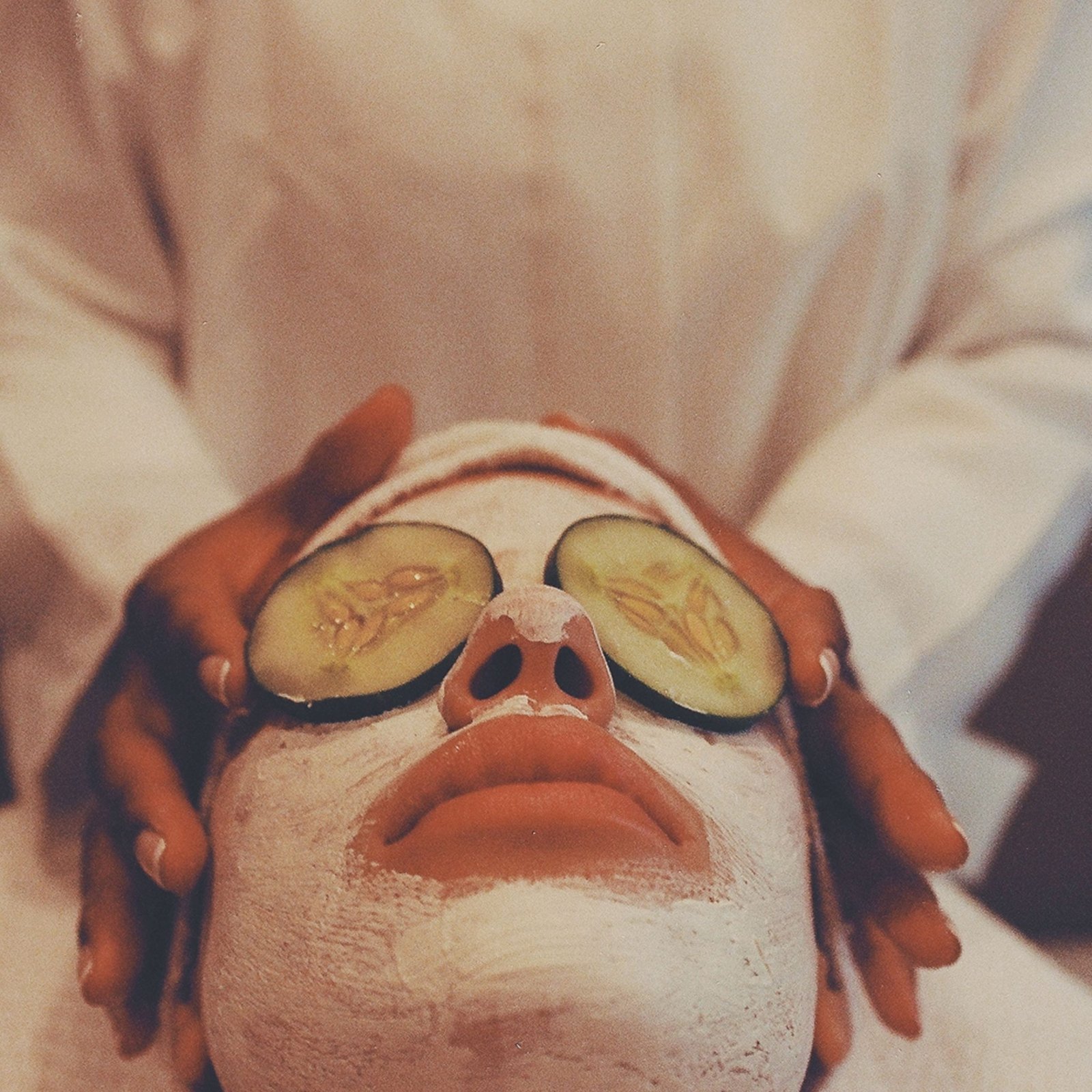A soothing spa facial with a cucumber mask for rejuvenation and relaxation.