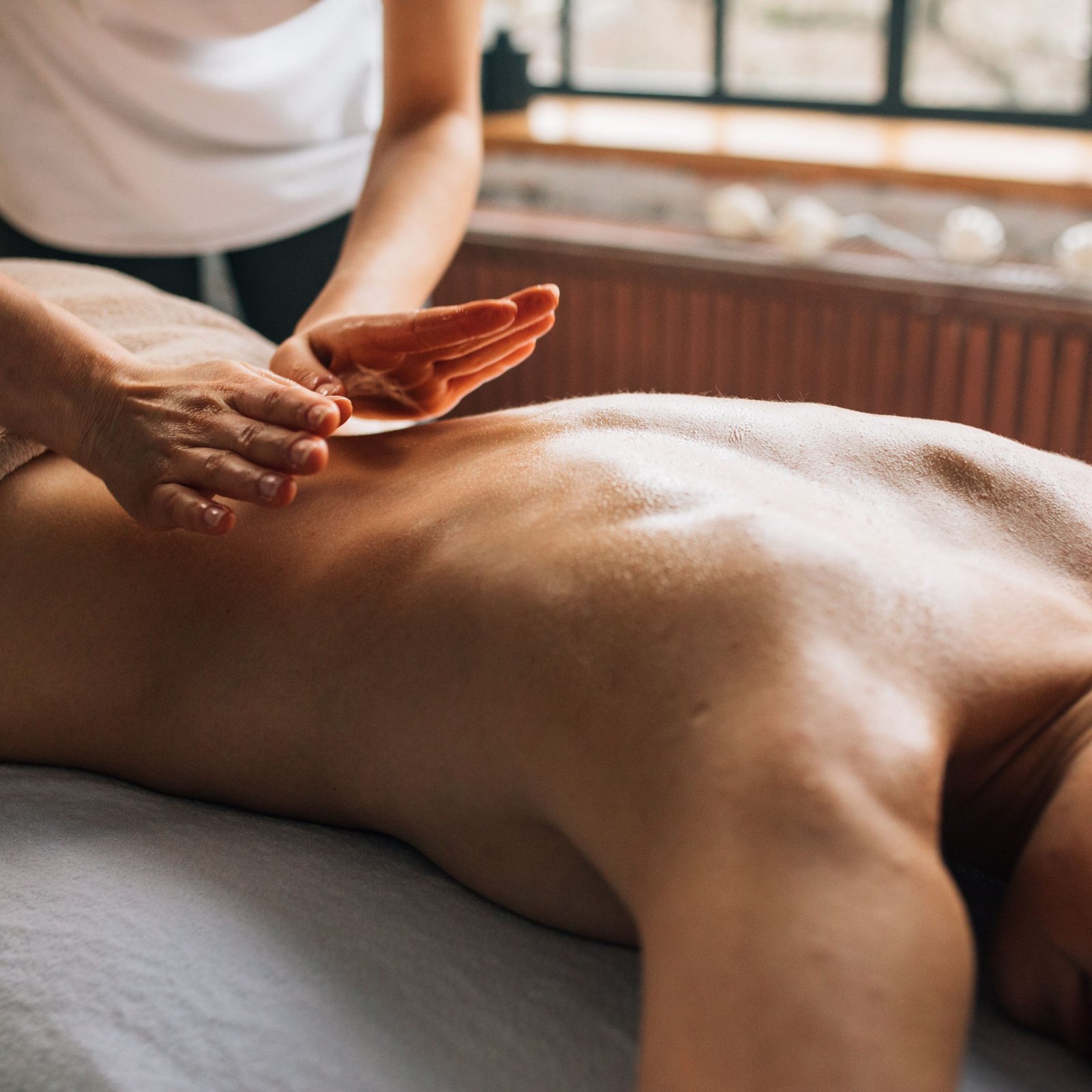A serene massage therapy session indoors focusing on relaxation and self-care.