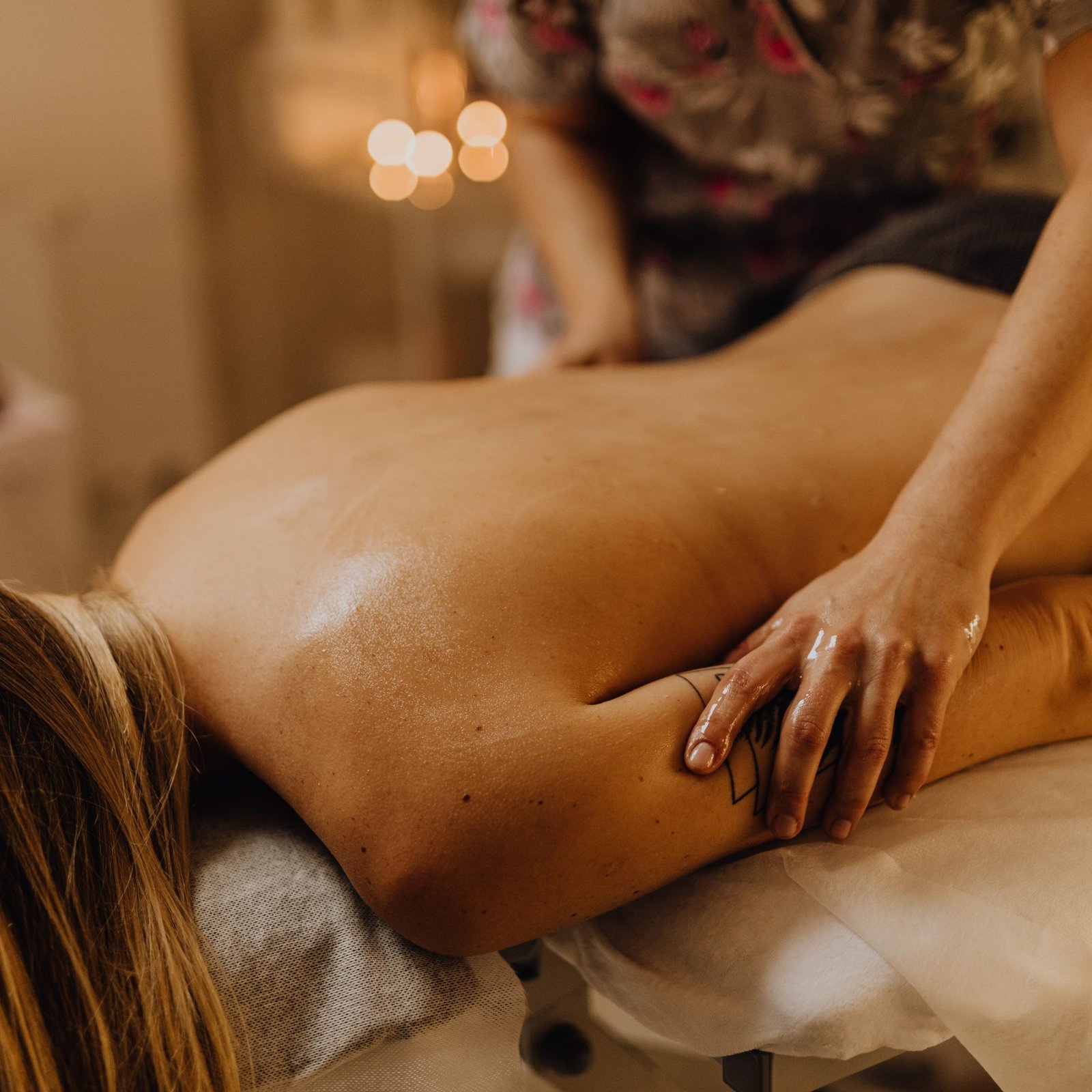 A soothing massage session in a tranquil spa, focusing on relaxation and wellness.