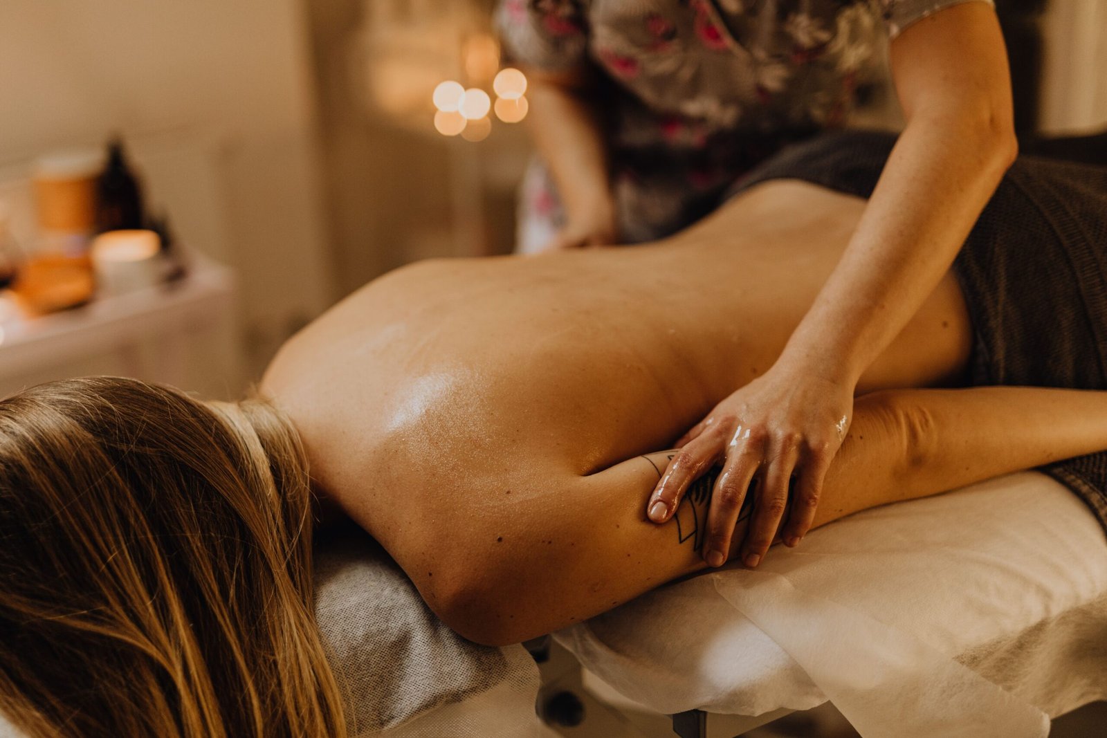 A soothing massage session in a tranquil spa, focusing on relaxation and wellness.